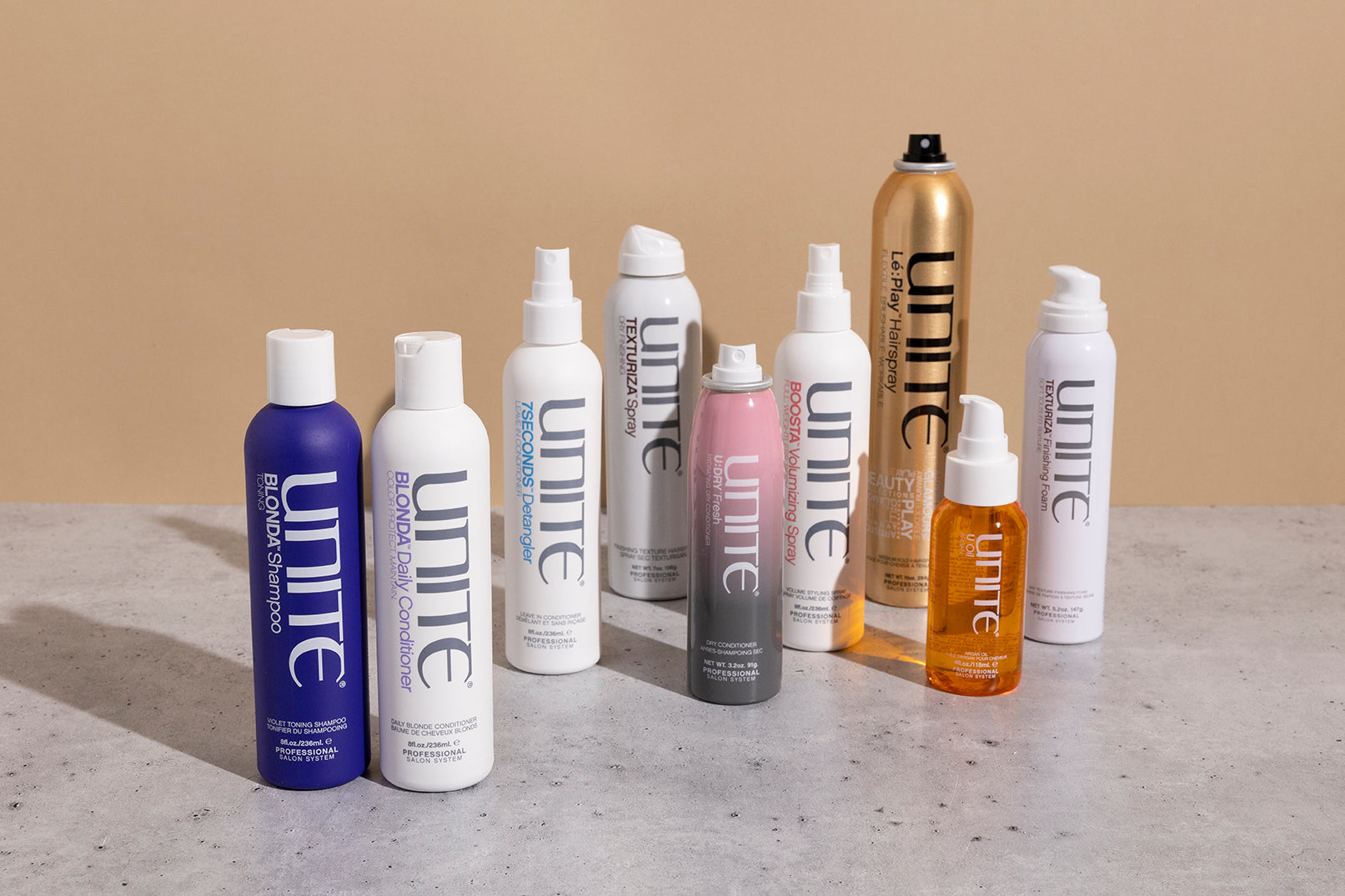 Multiple Unite haircare products sitting on a counter.